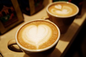 Cups of cappuccino sit on a table during the World Coffee Conference in Guatemala City